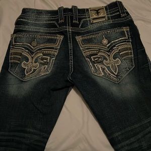 Selling rock revival jeans for 150. Dark blue barley used